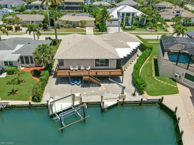 Aerial view of residential area with a large body of water