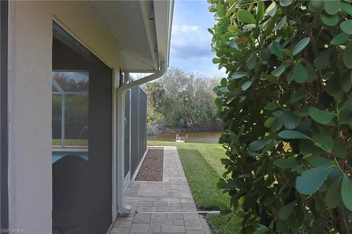 View of grassy yard with a patio