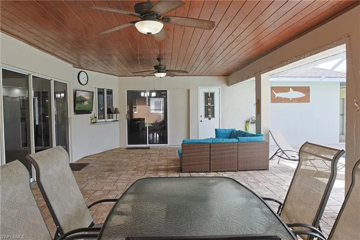 View of patio / terrace with an outdoor living / dining area and ceiling fan