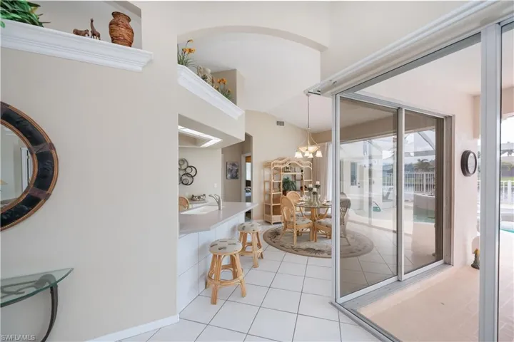 great room looking into the eat in kitchen area