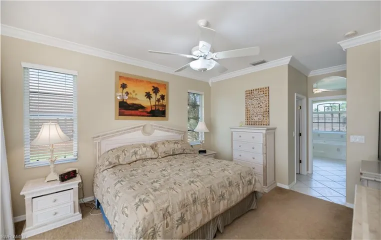 master bedroom looking into hallway to walk in closet and master bathroom