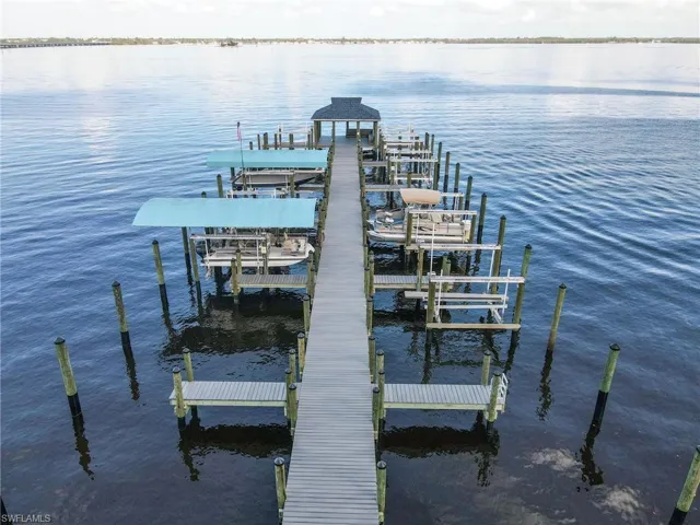 Dock featuring a water view and boat lift