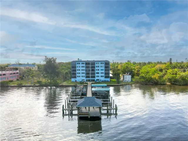 Dock featuring a water view and boat lift