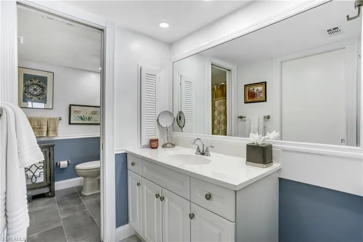 Bathroom with vanity and a shower with shower curtain
