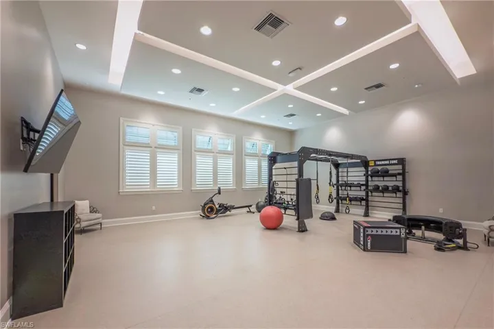 Workout area with baseboards and visible vents