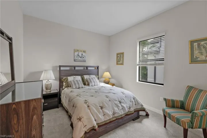 Bedroom featuring baseboards and carpet floors