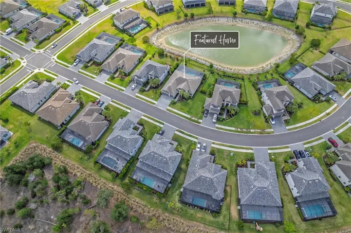 Aerial view featuring a water view and a residential view