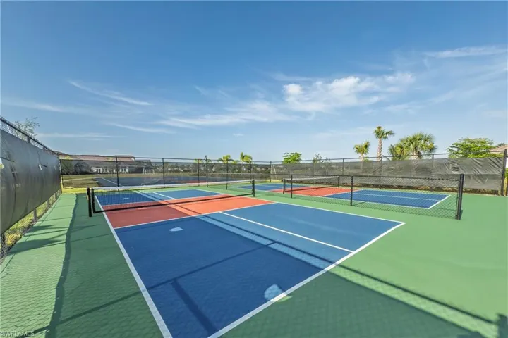 View of tennis court with fence