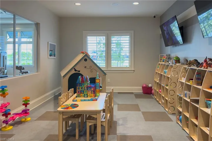 Rec room featuring baseboards and recessed lighting