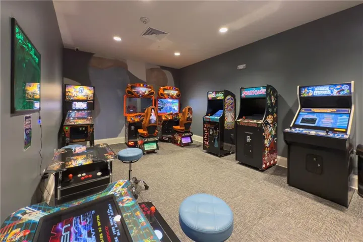 Recreation room featuring baseboards, recessed lighting, visible vents, and carpet floors