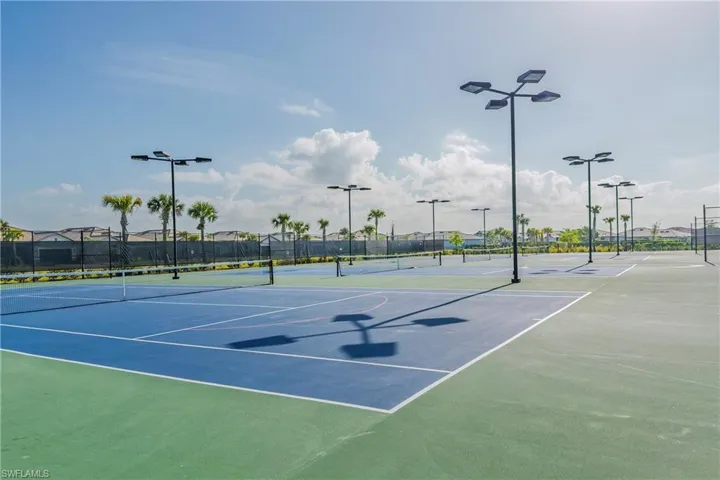 View of sport court featuring fence and community basketball court