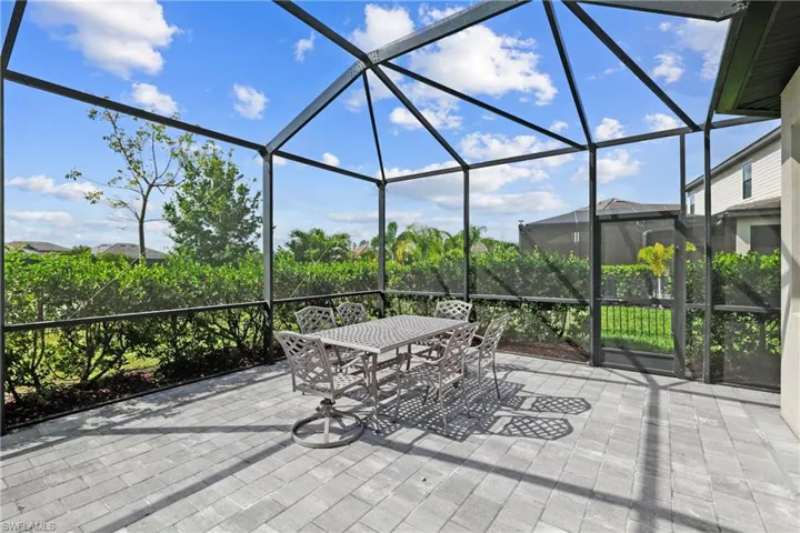 View of patio featuring a lanai and outdoor dining space