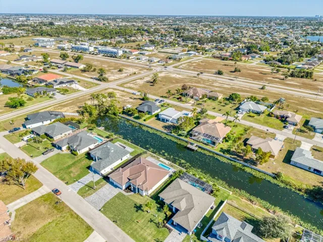 Aerial overview of property's location featuring nearby suburban area