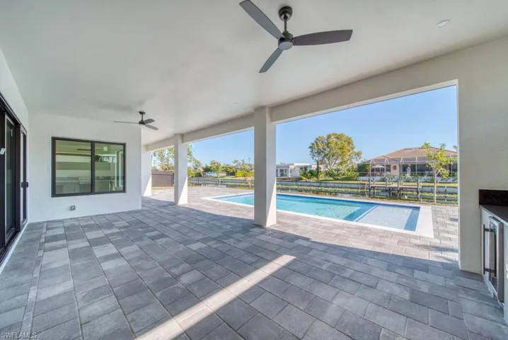View of swimming pool featuring a patio area and a fenced backyard