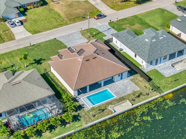 Aerial view of residential area featuring a pool