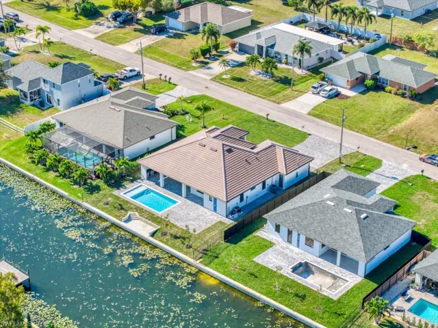 Aerial view of residential area featuring a large body of water