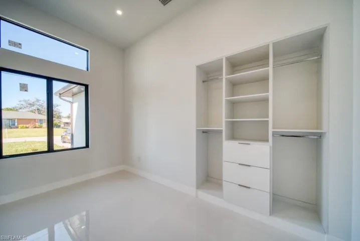 Unfurnished bedroom featuring baseboards and recessed lighting