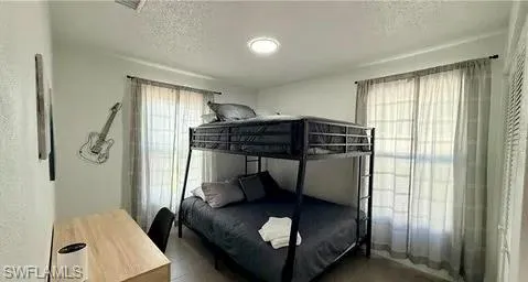 White walls with a flush-mount ceiling light