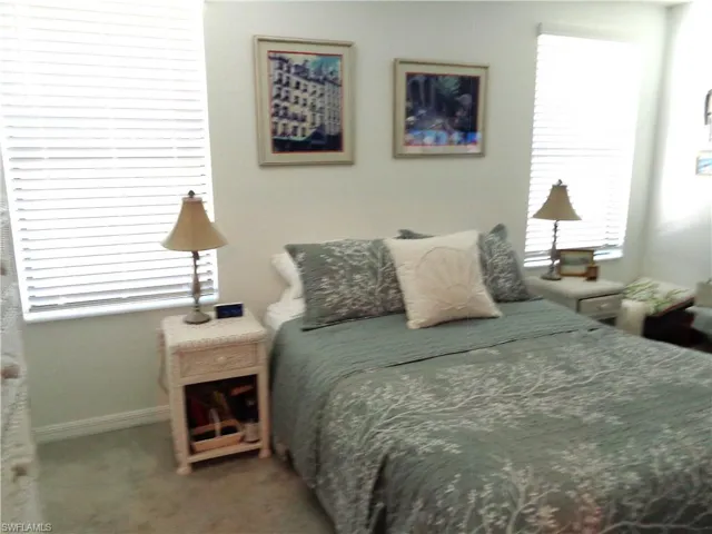 Bedroom with carpet and baseboards