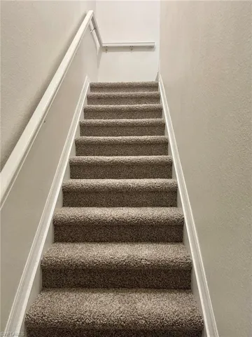 Staircase with a textured wall