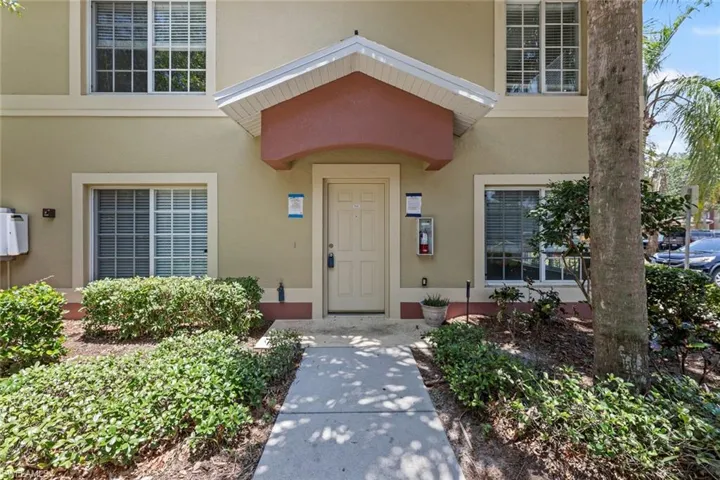 View of exterior entry featuring stucco siding