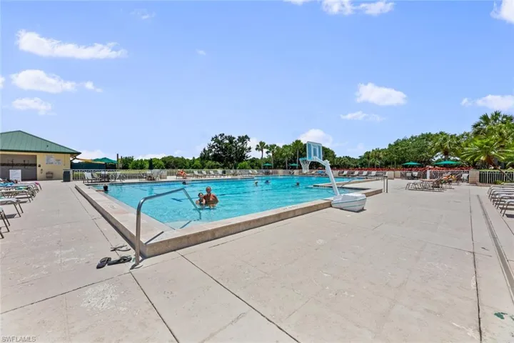 Community pool with a patio
