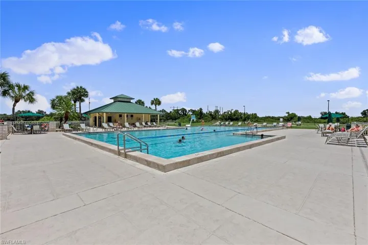 Community pool featuring a patio