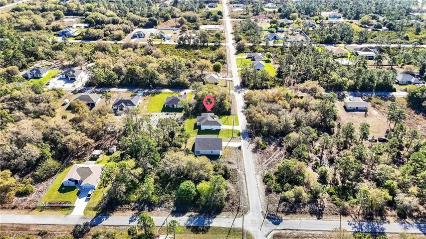 Aerial view of residential area with a tree filled landscape