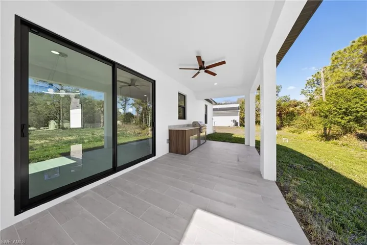 View of patio featuring ceiling fan