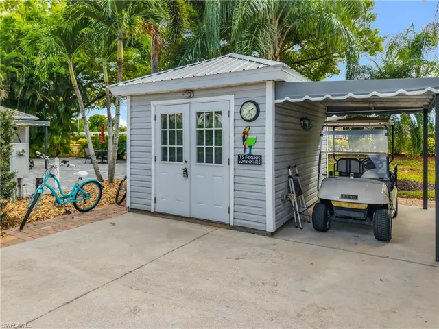 View of outdoor structure featuring a carport
