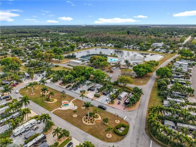 Aerial overview of property's location featuring a large body of water and nearby suburban area