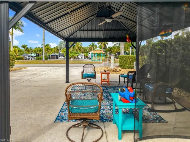 View of patio / terrace featuring a ceiling fan and a gazebo