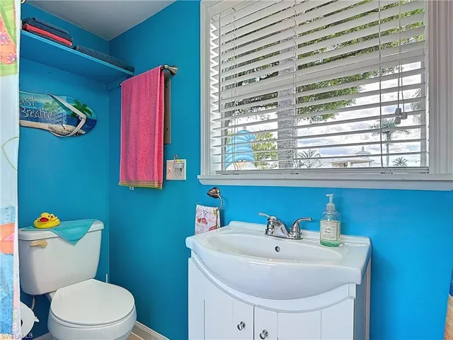 Bathroom featuring vanity and toilet