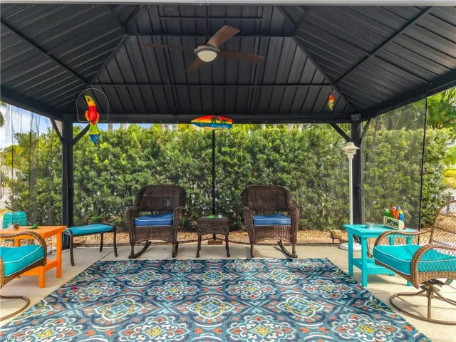 View of patio with a gazebo and ceiling fan