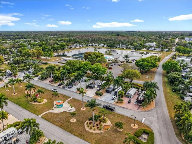 Aerial view of property's location featuring nearby suburban area and a nearby body of water