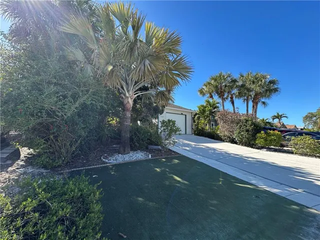 View of front of house featuring Putting Mat & Oversized Driveway