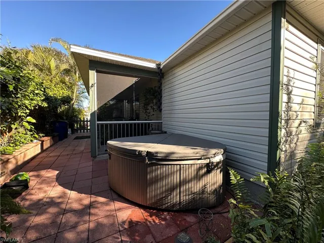 View of patio featuring a hot tub