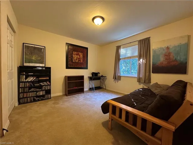 3rd Bedroom featuring light colored carpet