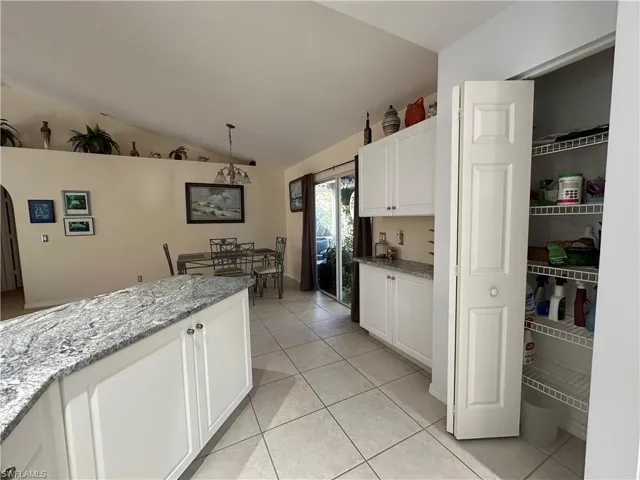 Kitchen featuring pantry & desk area as well as the Breakfast Bar and Dining area