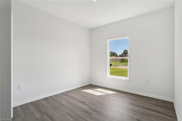 Empty room featuring hardwood / wood-style floors