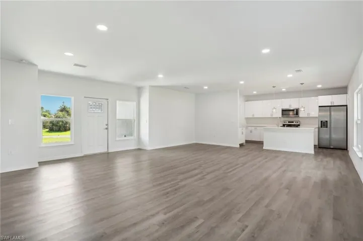 Unfurnished living room featuring hardwood / wood-style flooring