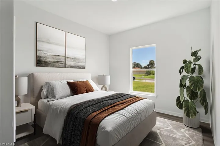 Bedroom with hardwood / wood-style floors