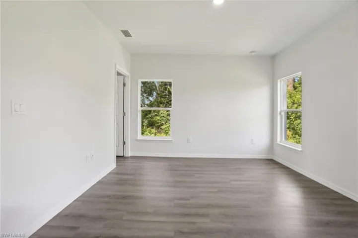 Spare room with hardwood / wood-style flooring