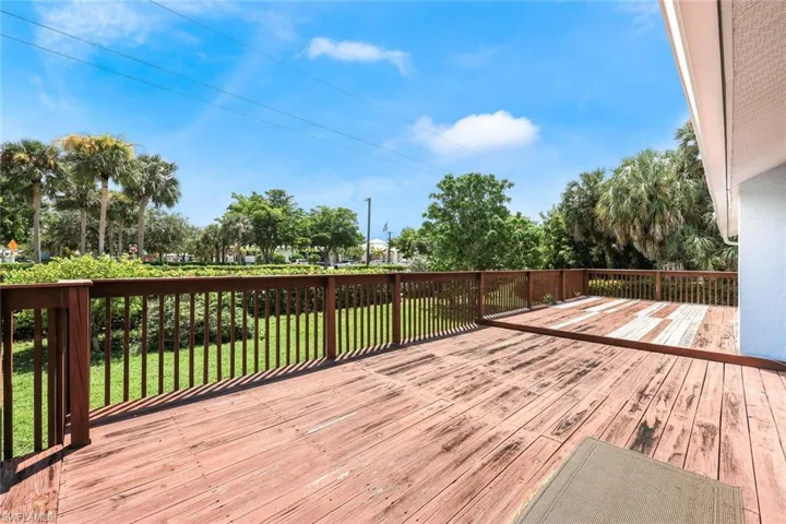Deck featuring a lawn
