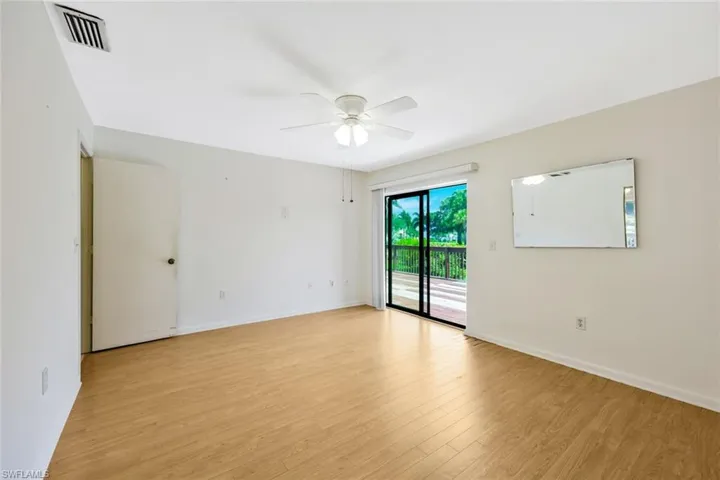 Spare room with ceiling fan and light hardwood / wood-style floors