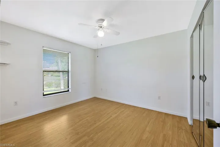 Unfurnished room featuring ceiling fan and light hardwood / wood-style floors