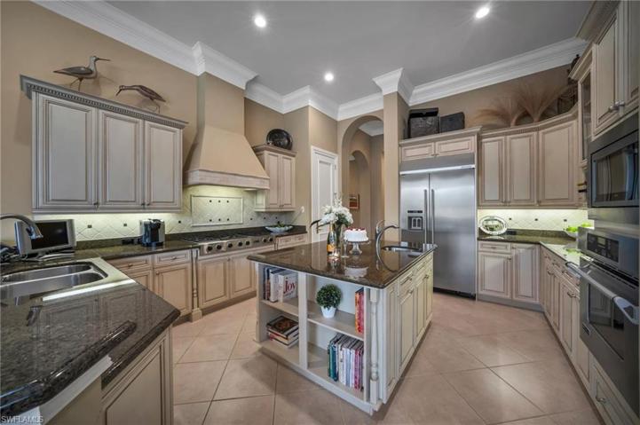 Gas range and abundant cabinetry with two pantries.