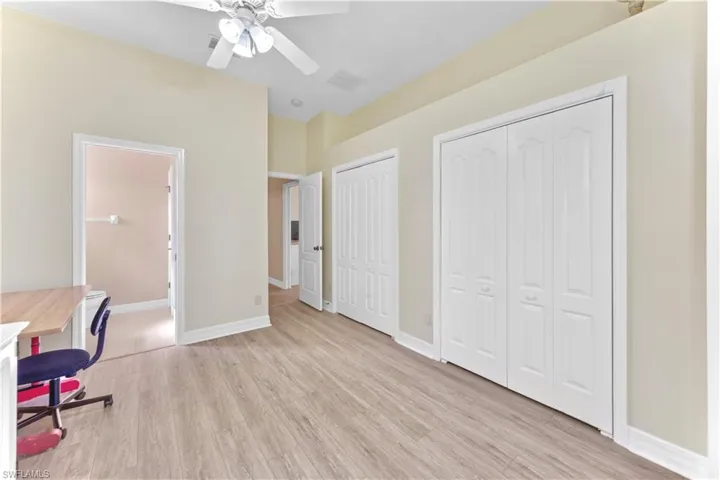 Office area featuring ceiling fan and light wood-type flooring