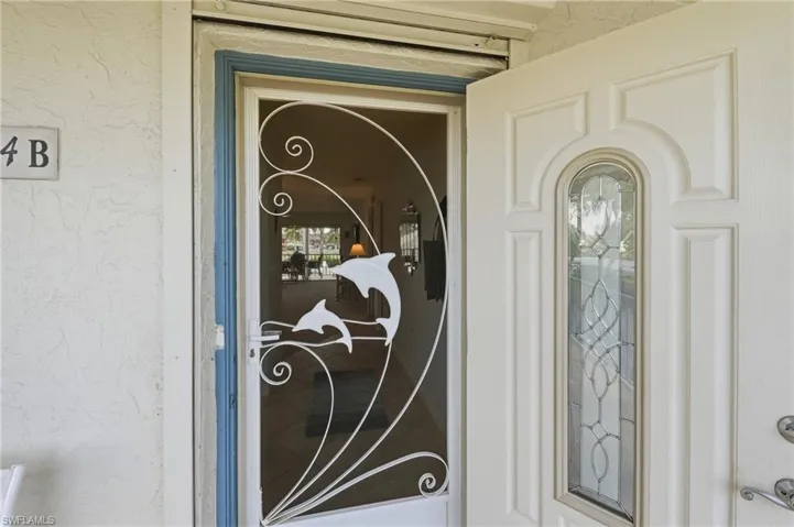 Paneled entry door with decorative glass inlay