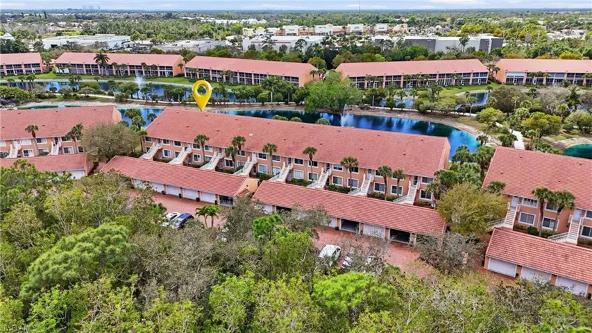Bird's eye view of apartment complex and a large body of water